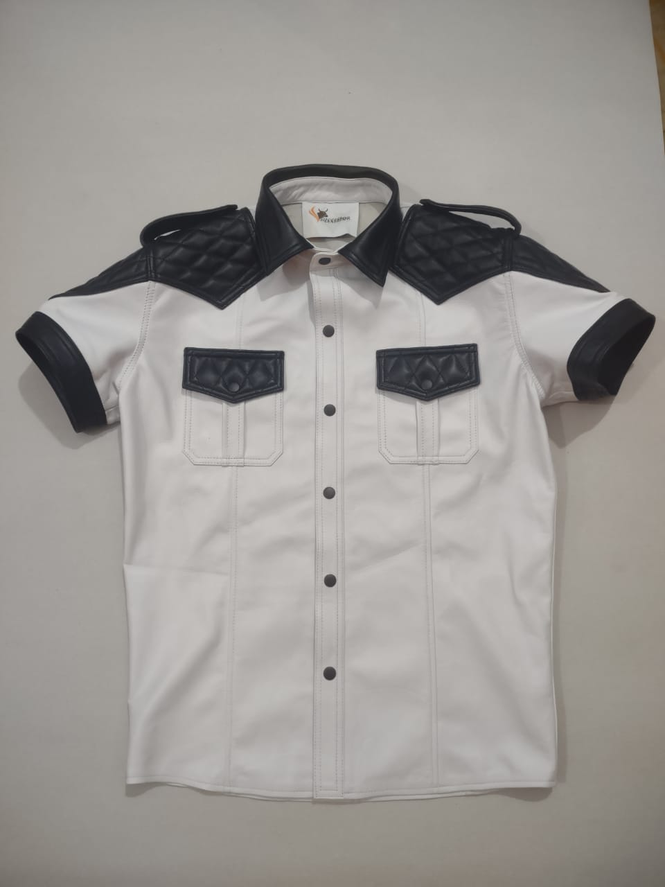 WHITE LEATHER SHIRT WITH BLACK QUILTED CONTRAST.