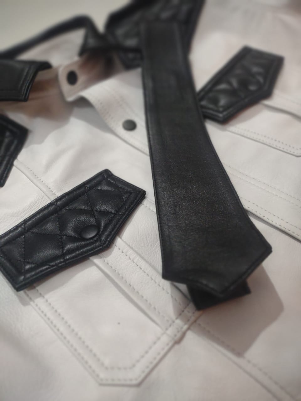 WHITE LEATHER SHIRT WITH BLACK QUILTED CONTRAST.