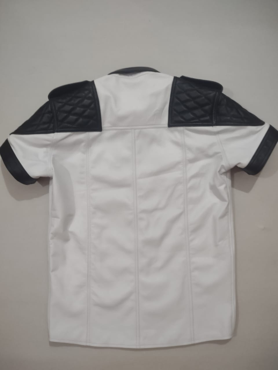 WHITE LEATHER SHIRT WITH BLACK QUILTED CONTRAST.