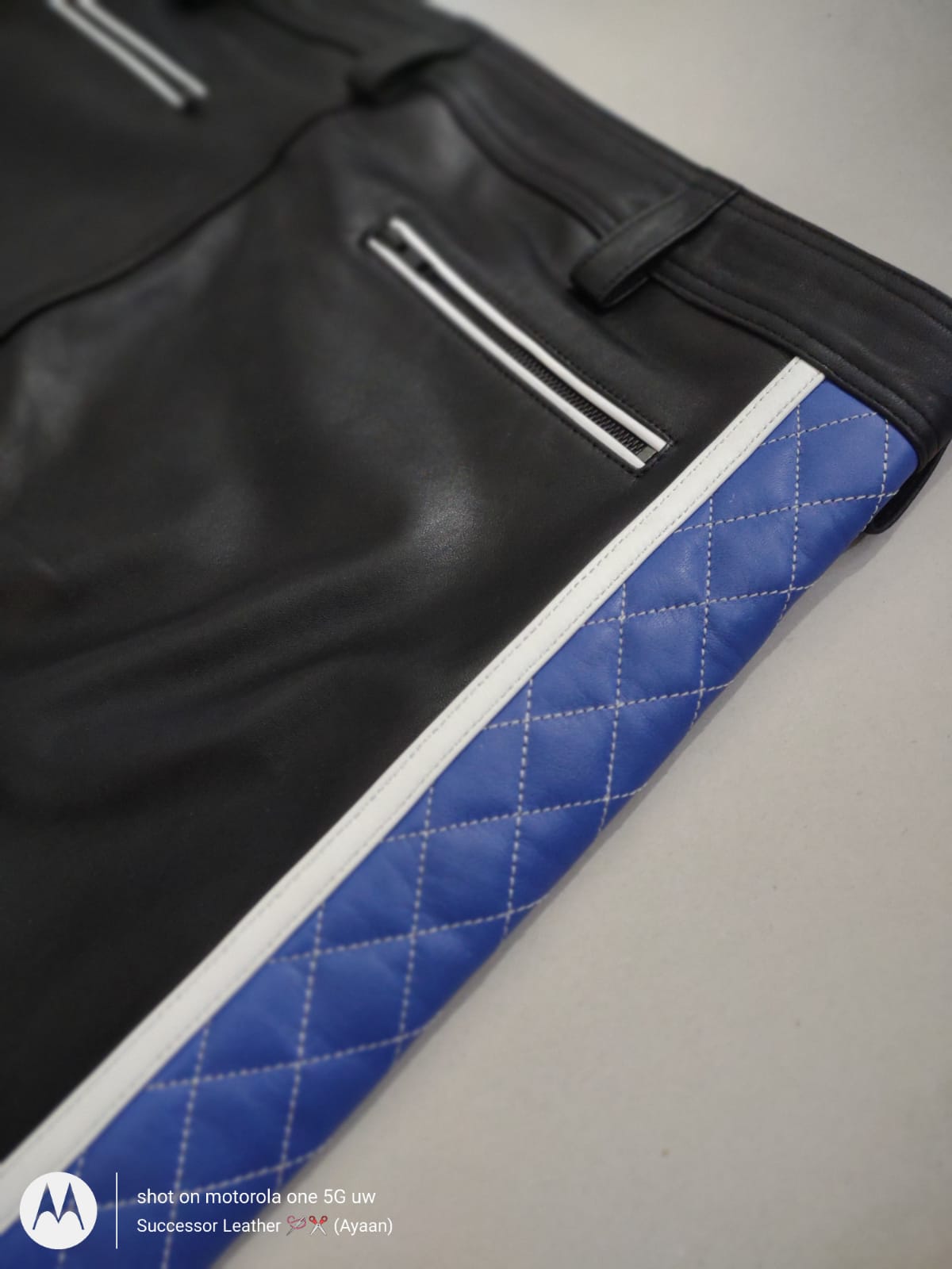 LEATHER PANT WITH BLUE QUILTED AND WHITE THREAD UNDER KNEE