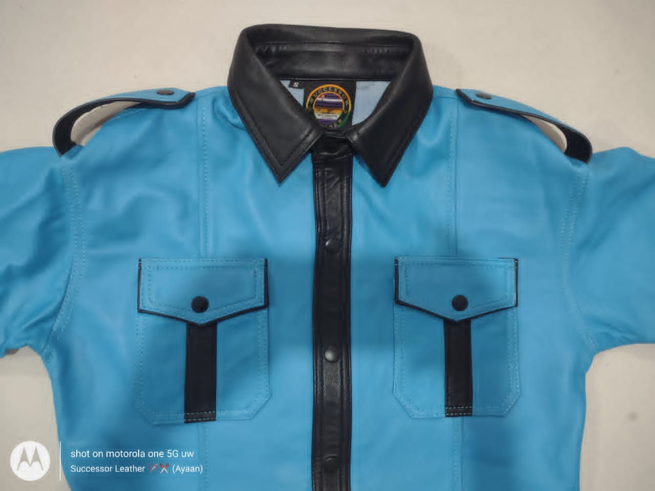 SKY BLUE LEATHER SHIRT WITH BLACK CONTRAST.