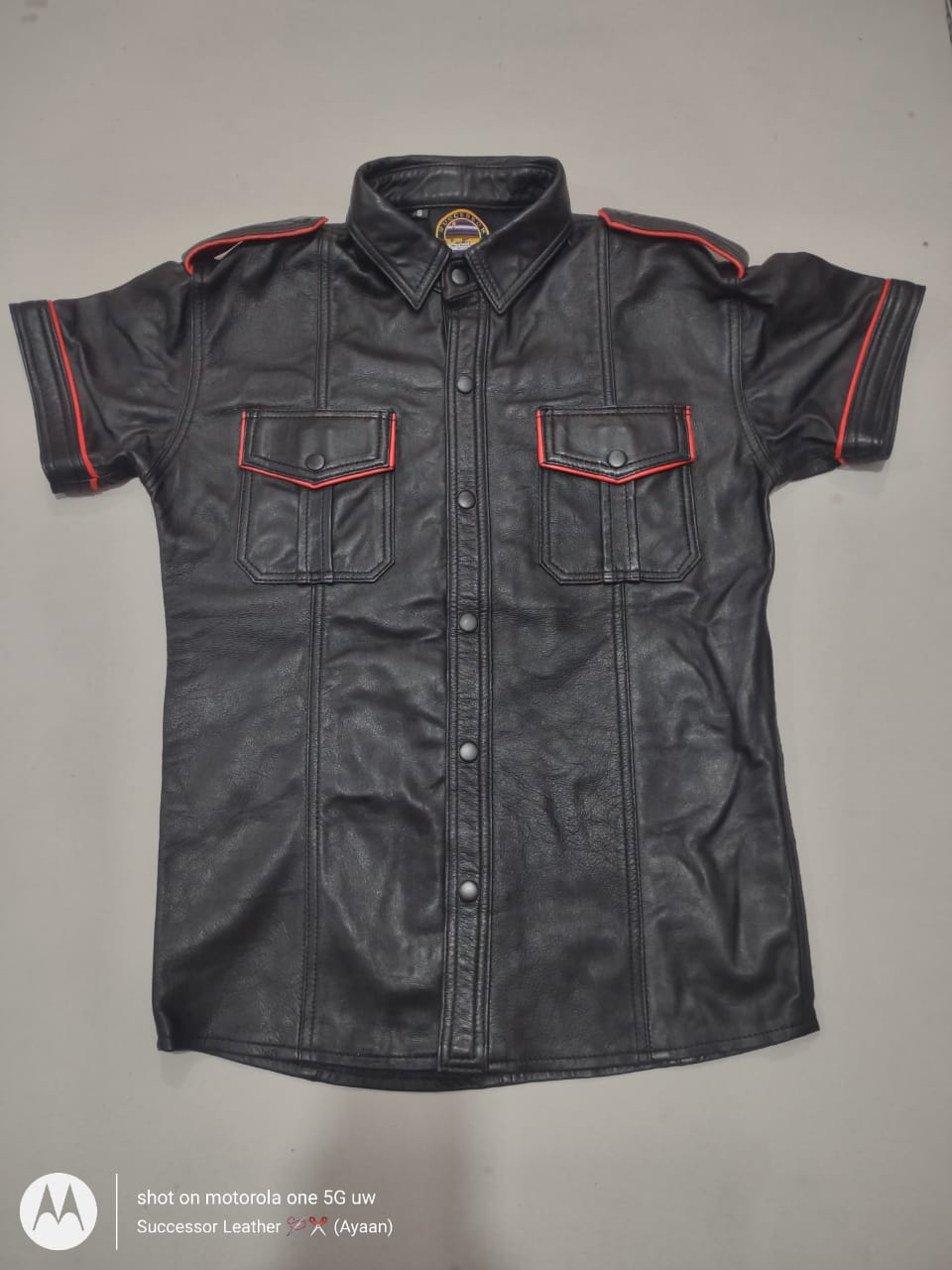 BLACK LEATHER SHIRT WITH RED CONTRAST.