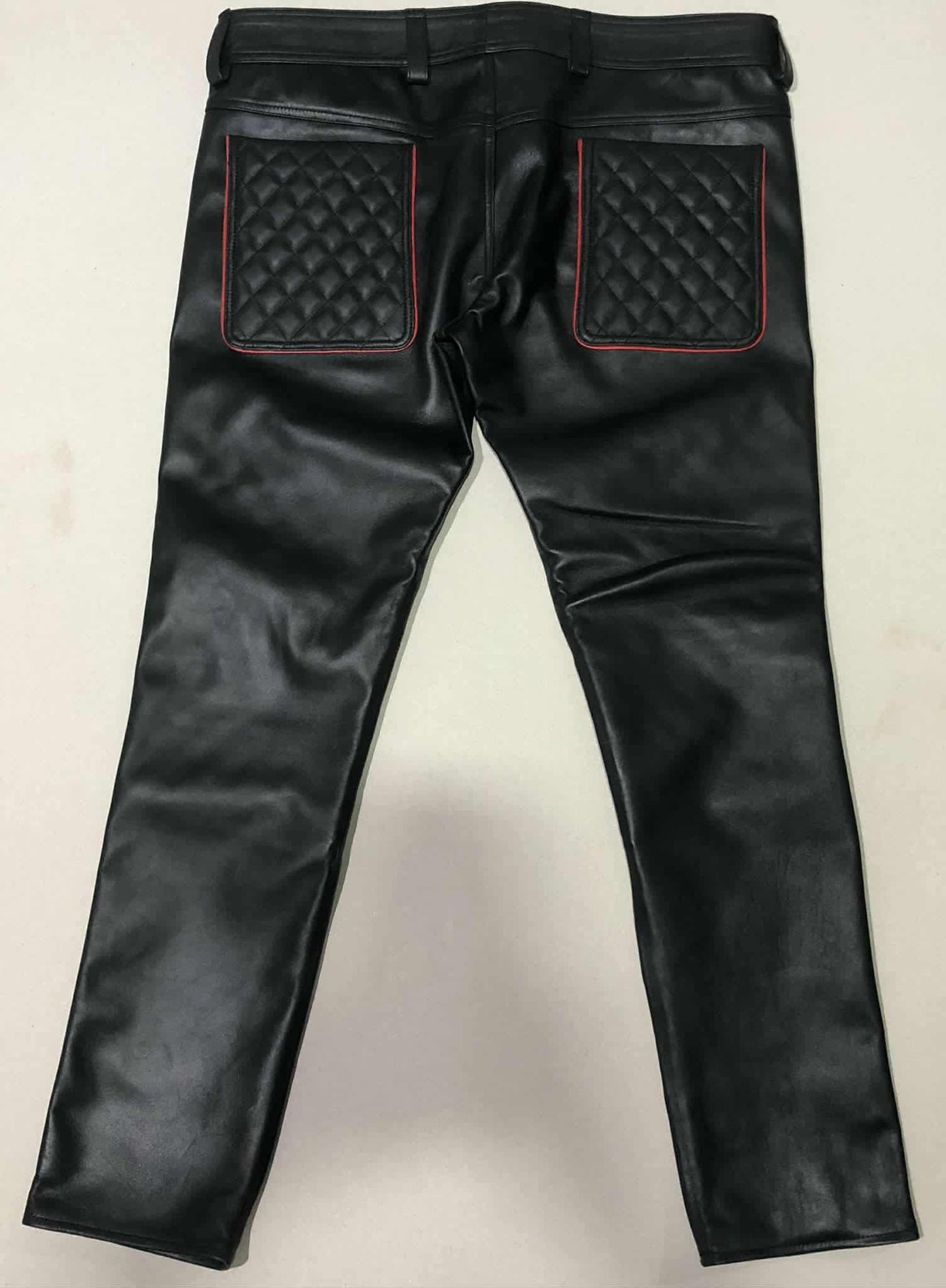 BLACK LAMB LEATHER QULITED PANT WITH RED TRIMS.