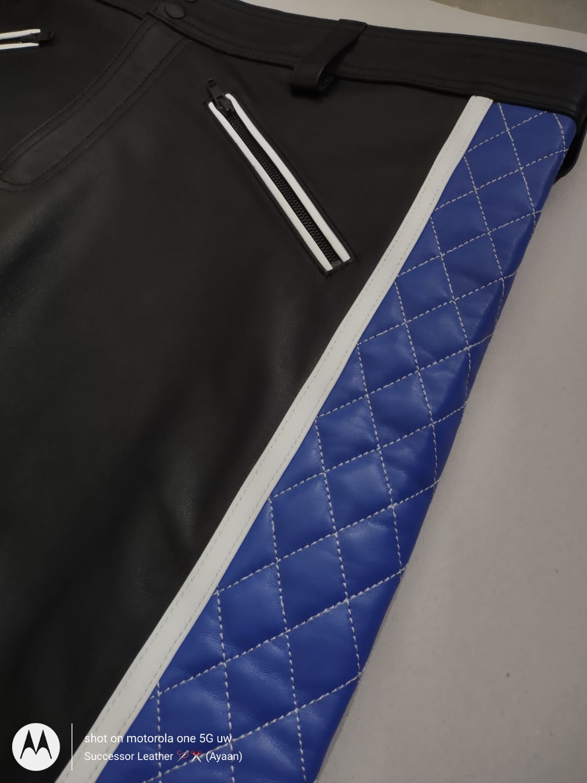 LEATHER PANT WITH BLUE QUILTED AND WHITE THREAD UNDER KNEE