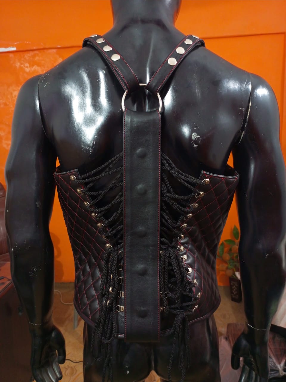 LEATHER QUILTED CORSET VEST WITH RED THREAD